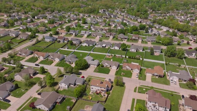Peaceful suburban neighborhood in the usa, showcasing rows of houses with well maintained lawns in a tranquil setting