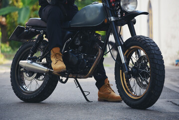Naklejka premium Asian man motorbike in black leather jacket travel rider trip. Handsome Men wear sunglass outdoor lifestyle freedom rider. Men trendy hipster cool person. Young asian man hobby ride with motor bike