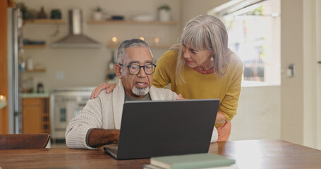 Senior couple, kitchen and laptop with internet connection for reading news and pension article. Interracial marriage, old man and woman with computer in home for online faq about retirement research