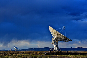 Four of 27 parabolic dishes spread our on the Plains of San Agustin, New Mexico 