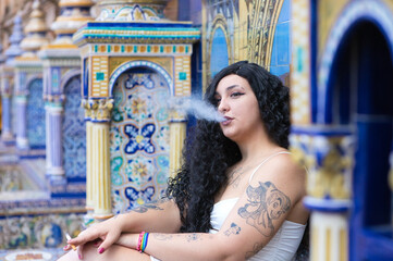 Young, beautiful, fat, curvy latin lesbian woman with long curly brown hair in a white dress...
