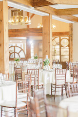Elegant banquet hall with wooden beams and tables in New Hampshire