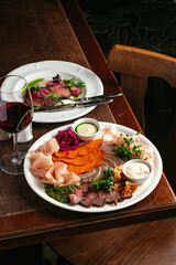 various cuts of meat on a plate. a meat plate. meat appetizer