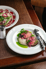 grilled beef tenderloin with sauce on a plate