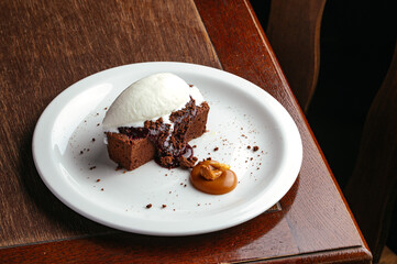 chocolate dessert with vanilla ice cream on a plate