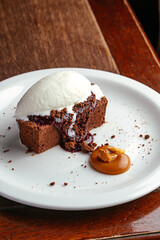 chocolate dessert with vanilla ice cream on a plate