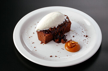 chocolate dessert with vanilla ice cream on a plate
