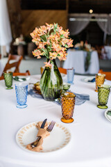 Autumn wedding table setting with cut glass goblets and plates