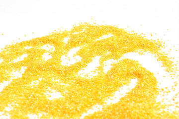 Corn polenta pile isolated on white, uncooked, top view, clipping path. High quality photo