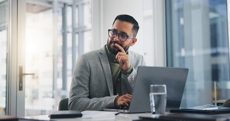 Office, laptop and businessman with thinking at desk for creative company, schedule and planning....