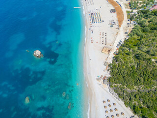 Aerial view of beach clubs along the Himare coastline part of the Albanian Riviera on the Ionian Sea in southern Albania 
