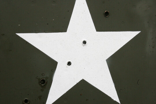 Invasion Star with bullet holes