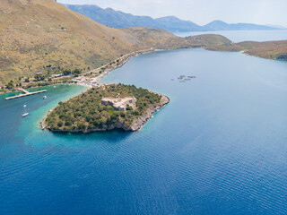 Naklejka premium Aerial view of Porto Palermo Castle along the Albanian coastline on the Ionian Sea in southern Albania