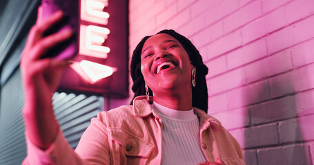 Happy woman, laughing and video call with phone at night for funny joke, meme or communication...