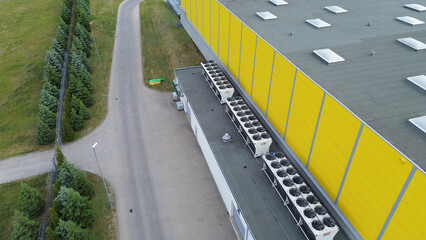 Fototapeta premium Aerial View of HVAC Units on Yellow Commercial Building