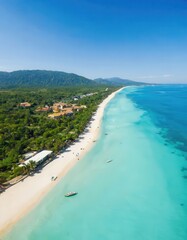 Obraz premium Aerial view of tropical beach with clear blue water and white sand.
