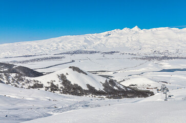 Fototapeta premium snowy Mount Aragats scenic view from Myler Mountain resort (Yeghipatrush, Armenia)
