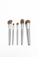 Cosmetic Makeup Brush Set, Isolated On White Background. Natural Bristle, Hair. Top View, Flat Lay. Professional Makeup Foundation, Eyeshadow, Angled, Blush, Blending Powder Brushes. Vertical Plane