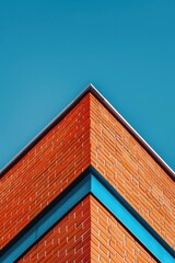 Red brick building on blue sky background, business center