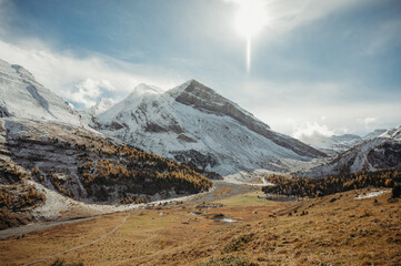 Swiss mountains in Sunnbüel Kandersteg in fall with sunlit snow peaks