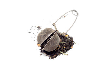 Metal tea strainer on a white background