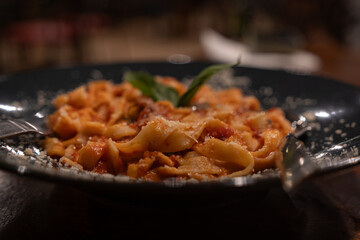 Traditional Italian linguini pasta with tomatoes and basil