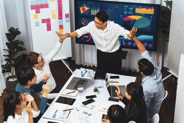 Excited and happy office worker employee celebrate after make successful strategic business...