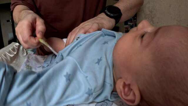 Baby on changing table during diaper change