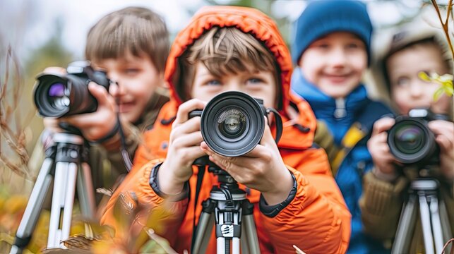 A group of children are posing for a photo with their cameras