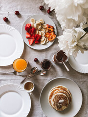 Tasty homemade breakfast set of pancakes fruits and berries set. Photo