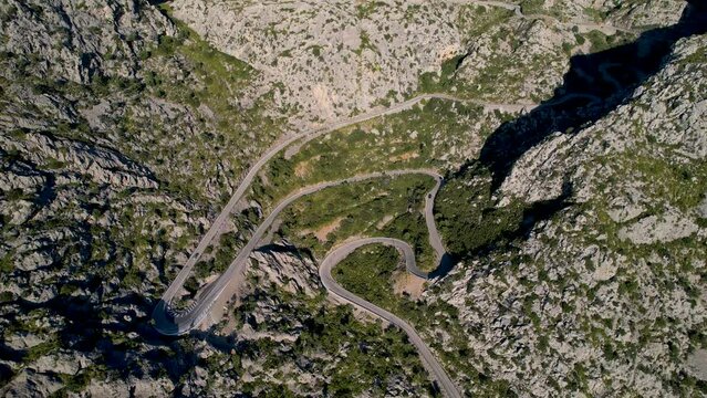 4K Aerial Drone video of mesmerizing serpentine roads in the mountains of Coll dels Reis, Nus de Sa Corbata, Mallorca