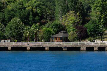 Fototapeta premium Blue seascape overlooking the coast. View of the Bosphorus in Istanbul city on sunny summer day, in a public place.