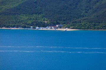 Blue seascape overlooking the coast. View of the Bosphorus in Istanbul city on sunny summer day, in a public place.