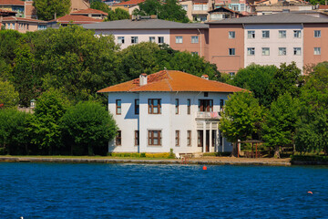 Obraz premium Blue seascape overlooking the coast. View of the Bosphorus in Istanbul city on sunny summer day, in a public place.