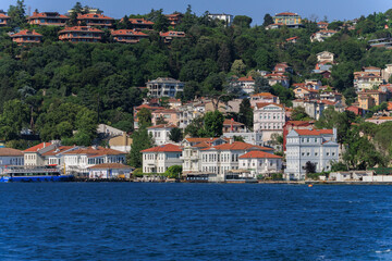 Obraz premium Blue seascape overlooking the coast. View of the Bosphorus in Istanbul city on sunny summer day, in a public place.