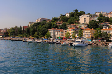 Fototapeta premium Blue seascape overlooking the coast. View of the Bosphorus in Istanbul city on sunny summer day, in a public place.