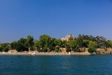 Blue seascape overlooking the coast. View of the Bosphorus in Istanbul city on sunny summer day, in a public place.