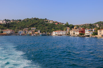 Fototapeta premium Blue seascape overlooking the coast. View of the Bosphorus in Istanbul city on sunny summer day, in a public place.