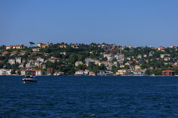 Blue seascape overlooking the coast. View of the Bosphorus in Istanbul city on sunny summer day, in a public place.