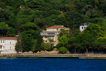 Fototapeta premium Blue seascape overlooking the coast. View of the Bosphorus in Istanbul city on sunny summer day, in a public place.