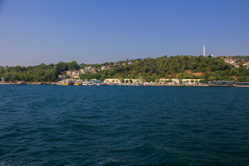 Blue seascape overlooking the coast. View of the Bosphorus in Istanbul city on sunny summer day, in a public place.