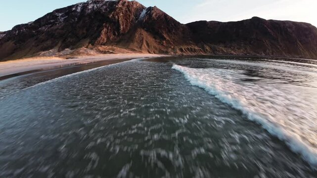 Ocean waves, beach and mountains in Hoddevik, aerial view