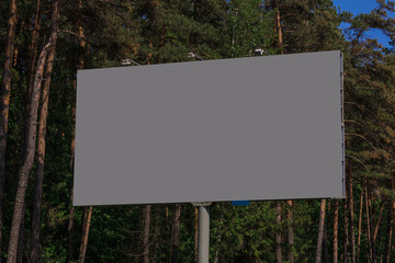 White billboard along the highway. Background for design and advertising. 