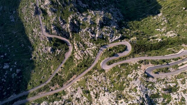 4K Aerial Drone video of mesmerizing serpentine roads in the mountains of Coll dels Reis, Nus de Sa Corbata, Mallorca