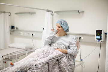 Young woman in hospital recovery room after surgery