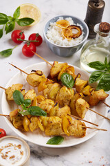 Shashlik or kebab made from chicken fillet meat with onion and pepper. Meat on skewers. 