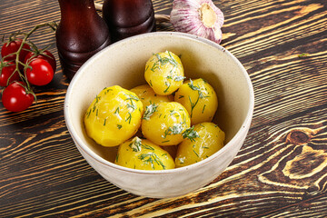 Boiled potato with oil and dill