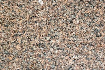 Closeup of granite surface with small stones, showing natural pattern