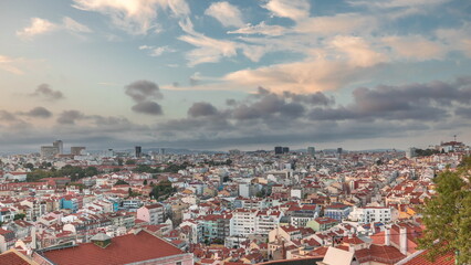 Fototapeta premium Panorama showing Lisbon famous aerial view from Miradouro da Senhora do Monte tourist viewpoint timelapse