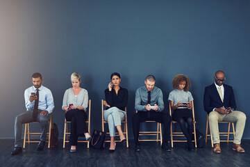 Business people, hiring and waiting in row with technology for recruitment process and employment opportunity. Diverse group, job seeker and phone in line for HR meeting with mockup space and company